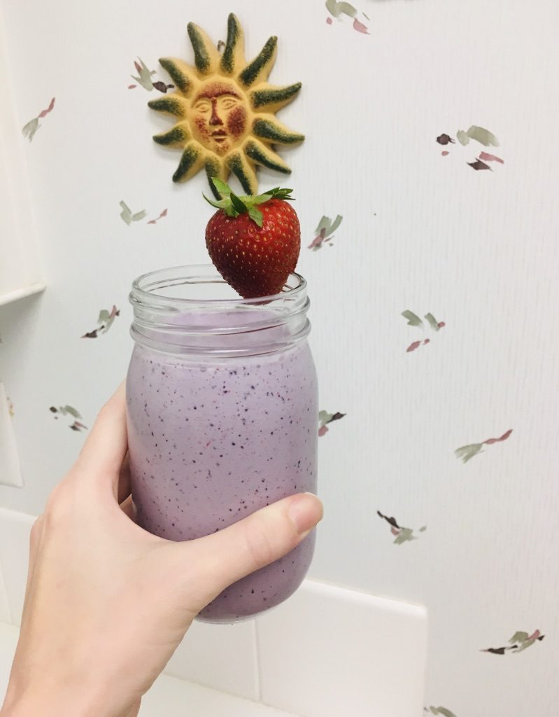 energizing morning smoothie in woman's hand