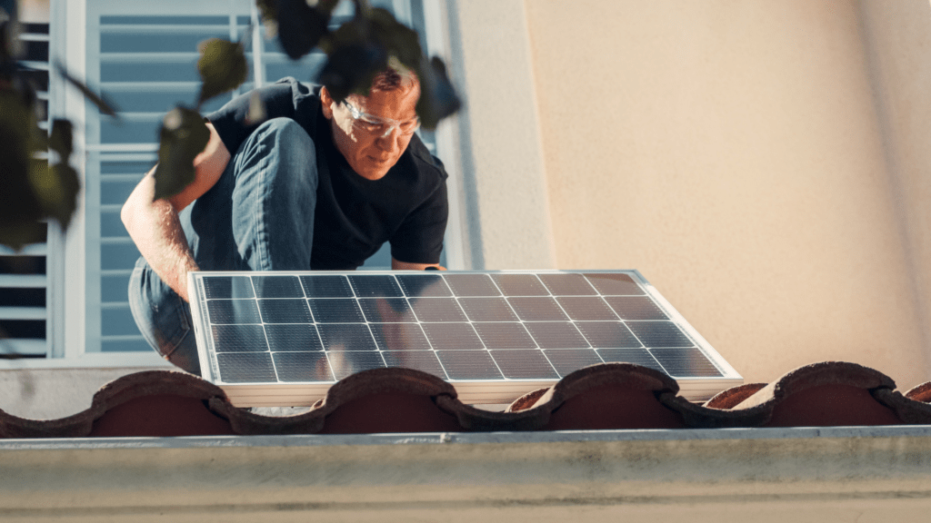 man installing solar panels for an eco-friendly home office