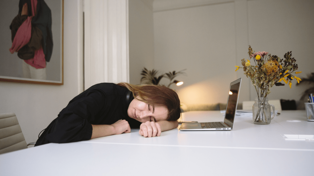 Midday Slump: How to Have Energy All Day, woman sleeping at computer